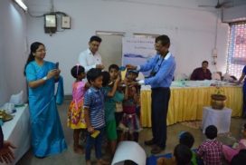 Dr, M.N Roy handing over the Champion trophy of poster competition